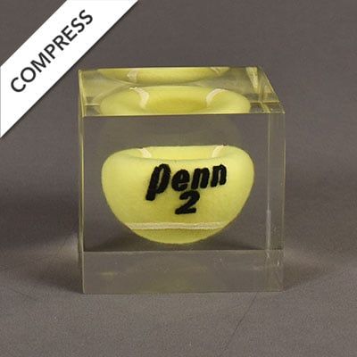 Compressed Penn® tennis ball showing acrylic embedment failure.